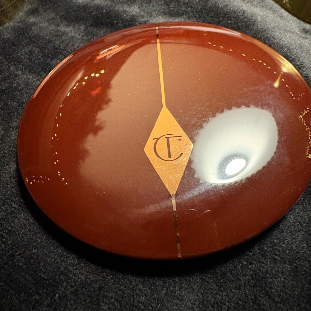 Charlotte Tilbury Deep Burgundy Compact with Gold Accent Blush